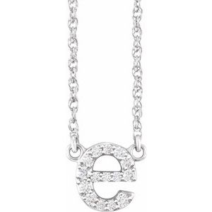 Silver initial letter E pendant necklace with sparkling pavé diamonds.