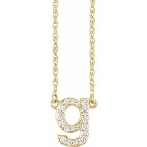 Gold initial letter g pendant necklace with sparkling diamonds.