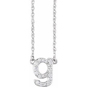 Silver initial 9 pendant necklace with sparkling pavé diamonds on a delicate chain.