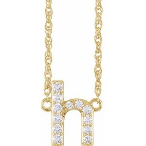 Gold initial H pendant necklace with sparkling diamonds.