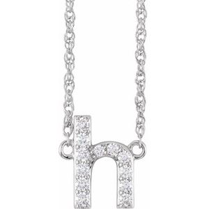 Silver letter H pendant necklace encrusted with sparkling diamonds.