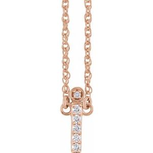 Rose gold chain necklace with a diamond-encrusted vertical bar pendant