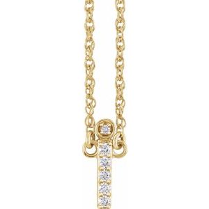 Gold initial I pendant necklace featuring sparkling pavé diamonds.