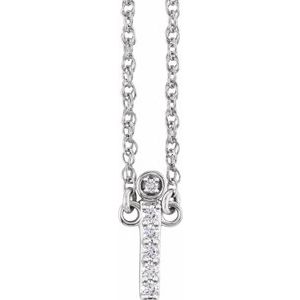 Diamond-encrusted silver cross pendant on a delicate silver chain