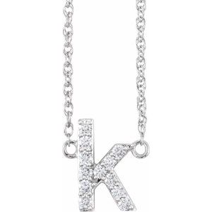 Diamond-encrusted letter K pendant on a silver chain