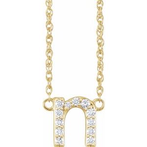 Gold necklace with a diamond-encrusted letter N pendant