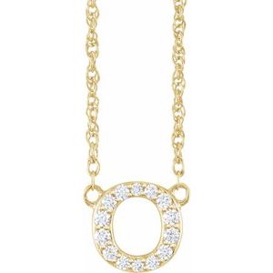 Gold chain necklace with a diamond-encrusted letter O pendant