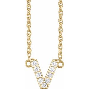 Gold initial V necklace encrusted with sparkling diamonds.