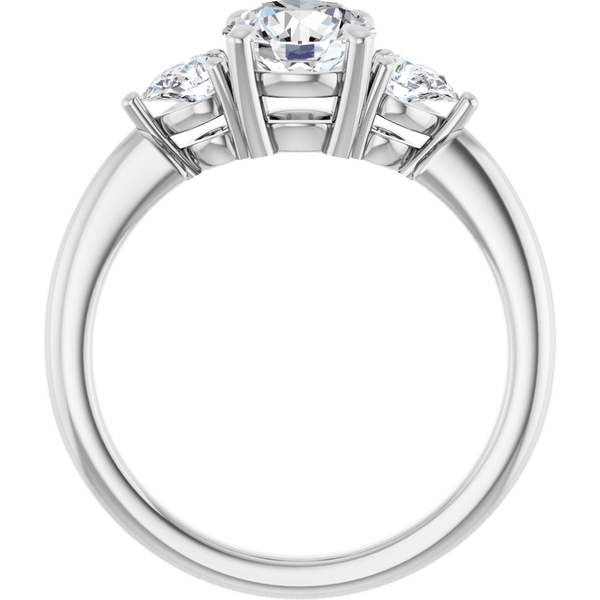 Three-stone diamond engagement ring in white gold with brilliant cut gemstones.