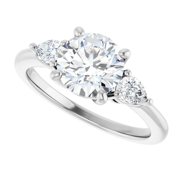Lab-grown diamond engagement ring with a center round cut stone and pear side accents