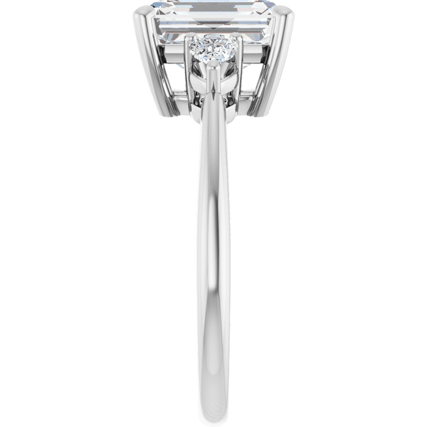 Side view of an emerald-cut diamond engagement ring in white gold with a side accent stone.