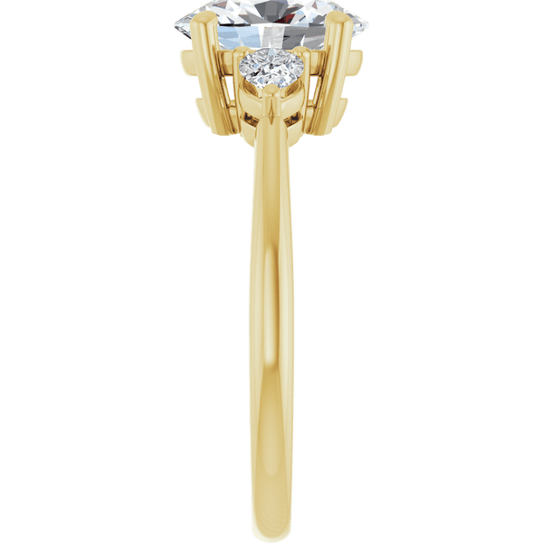 Yellow gold engagement ring featuring a large brilliant diamond and side stone setting.