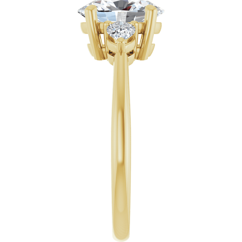 Yellow gold engagement ring featuring a large brilliant diamond and side stone setting.