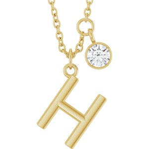 Gold initial H necklace with a small round diamond charm