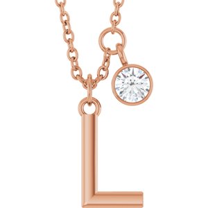 Rose gold initial L pendant necklace with a sparkling round diamond charm