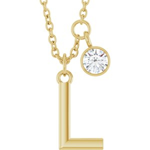 Gold initial L pendant necklace with a sparkling round diamond charm.