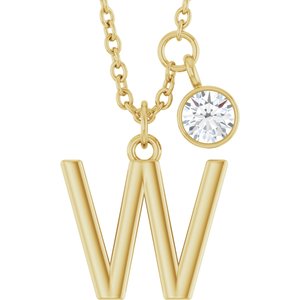 Gold initial W letter pendant necklace with a sparkling round diamond charm.