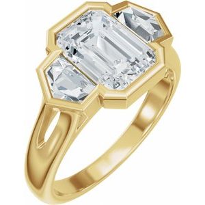 Yellow gold ring with a central emerald-cut lab-grown diamond and side accents