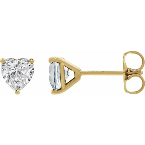 Heart-shaped lab-grown diamond stud earrings in yellow gold.