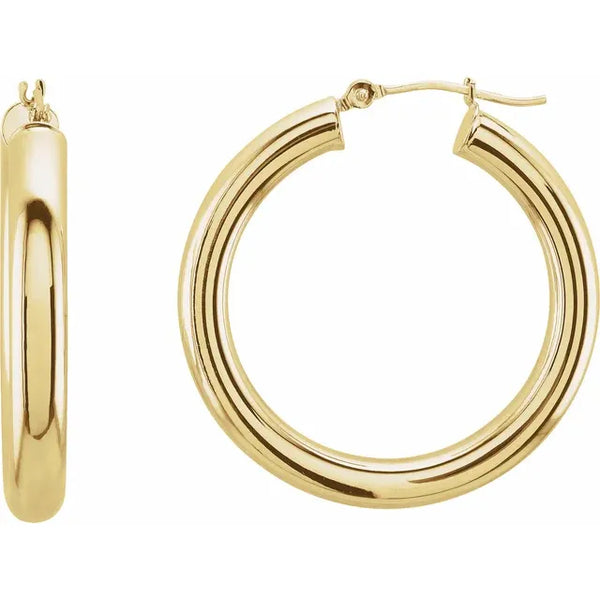 Polished yellow gold thick hoop earrings with a smooth tubular design.