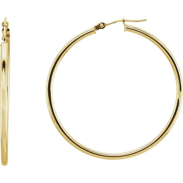 Large gold hoop earrings in polished yellow gold.