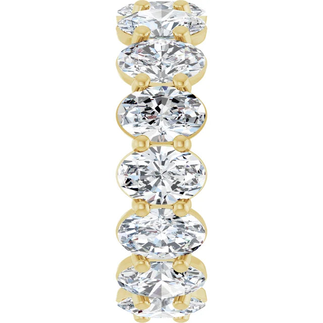 Oval cut lab-grown diamond eternity band in polished yellow gold