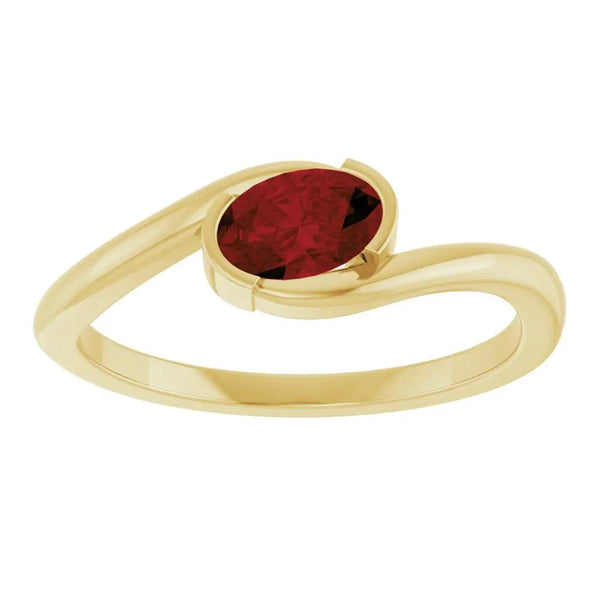 Beucher Paris 14K gold solitaire ring featuring an oval natural Mozambique garnet.