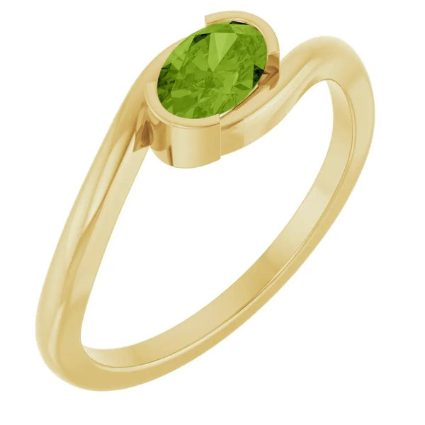 14K yellow gold ring with a vibrant green natural peridot solitaire gemstone.