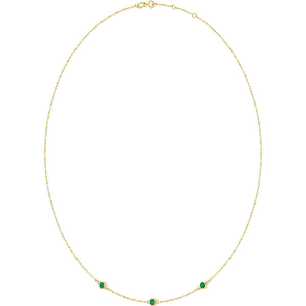 Fine gold chain necklace featuring three small round green gemstones