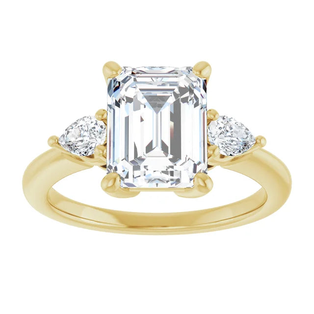 Emerald cut diamond engagement ring with side stones in yellow gold