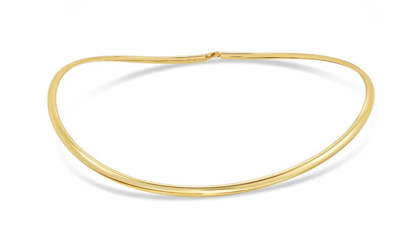 A thin, polished yellow gold chain necklace arranged in a loose oval on a clean white background.