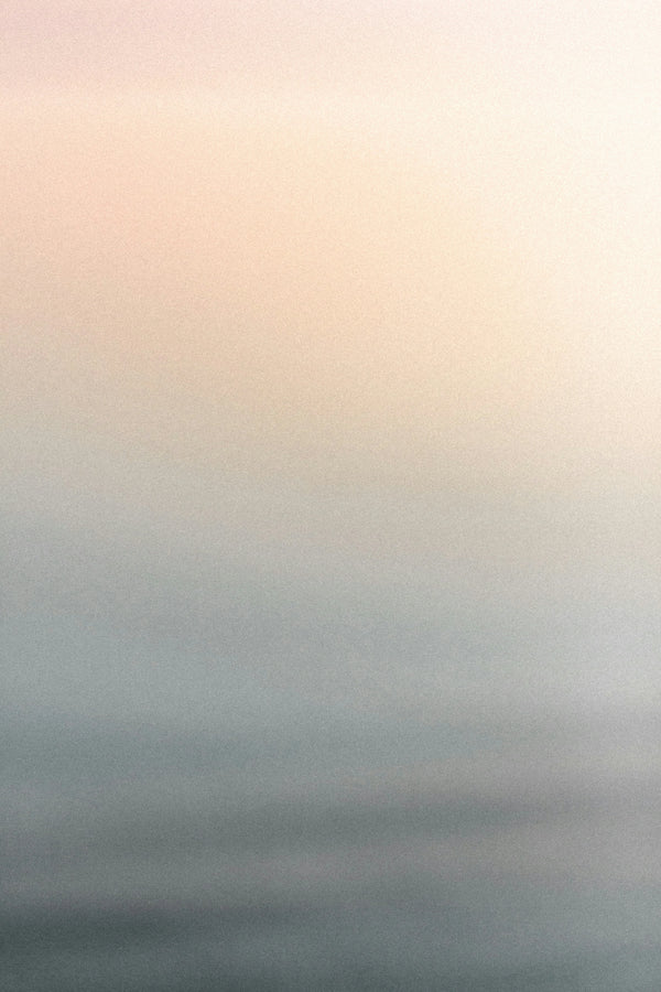 Soft gradient background with pastel peach and muted blue tones.
